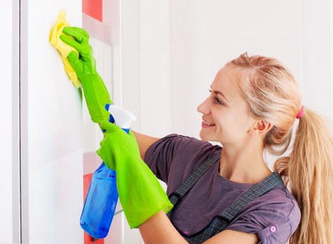 Professional cleaner preparing a Stockwell home for a thorough cleaning service