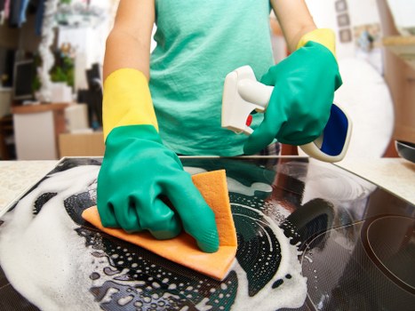 Professional cleaner reviewing safety procedures on site