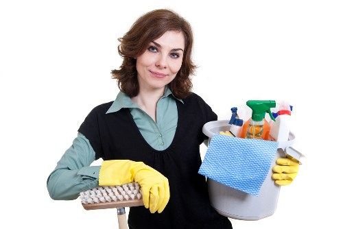 Upholstery cleaner treating stains on a sofa in Stockwell